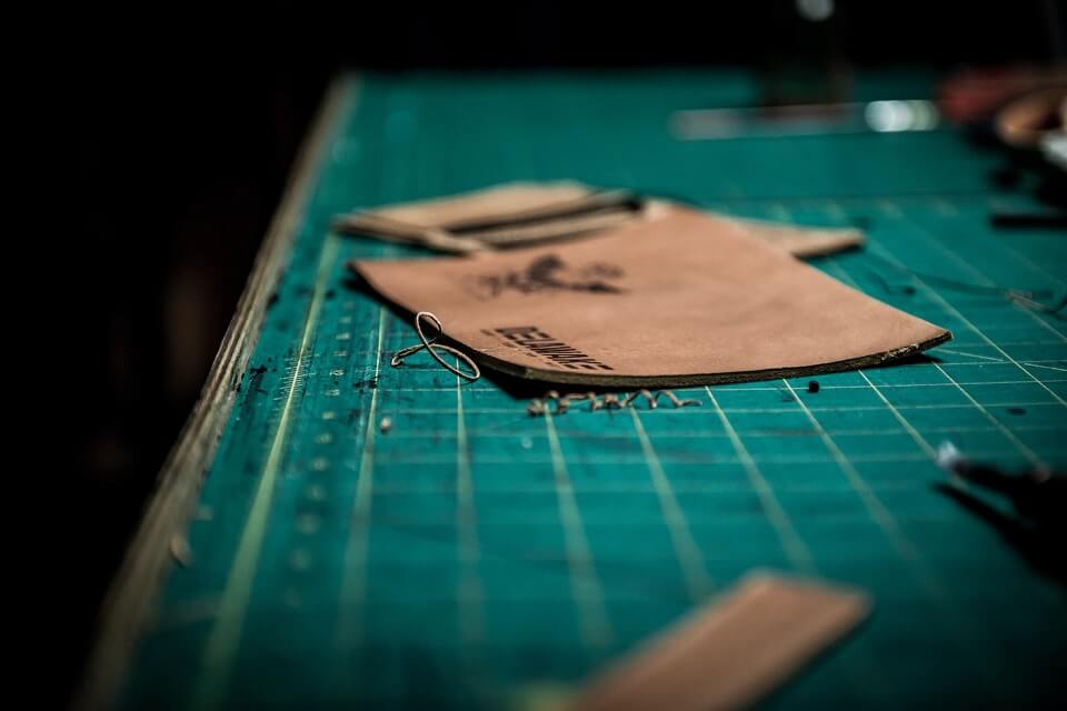 pieces of leather on work table