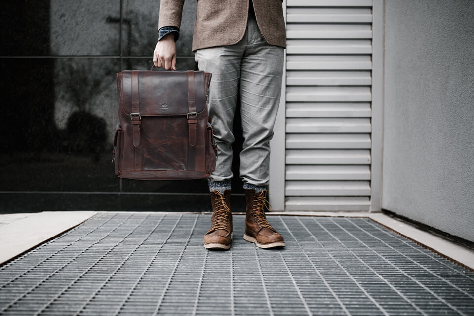 Business man with dark brown leather messenger bag