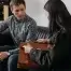 salesperson showing customer a leather briefcase